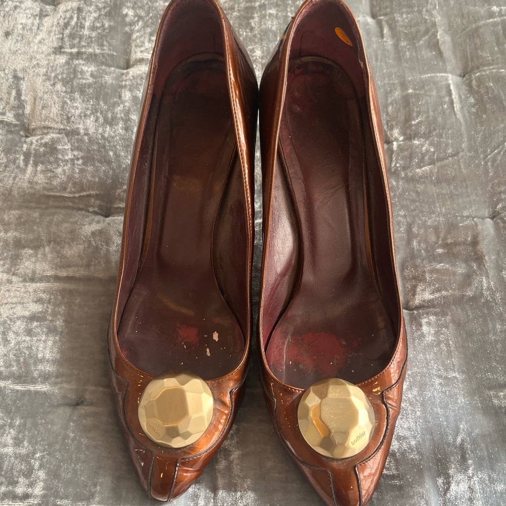 Botkier bronze patent heels with gold medallion detail